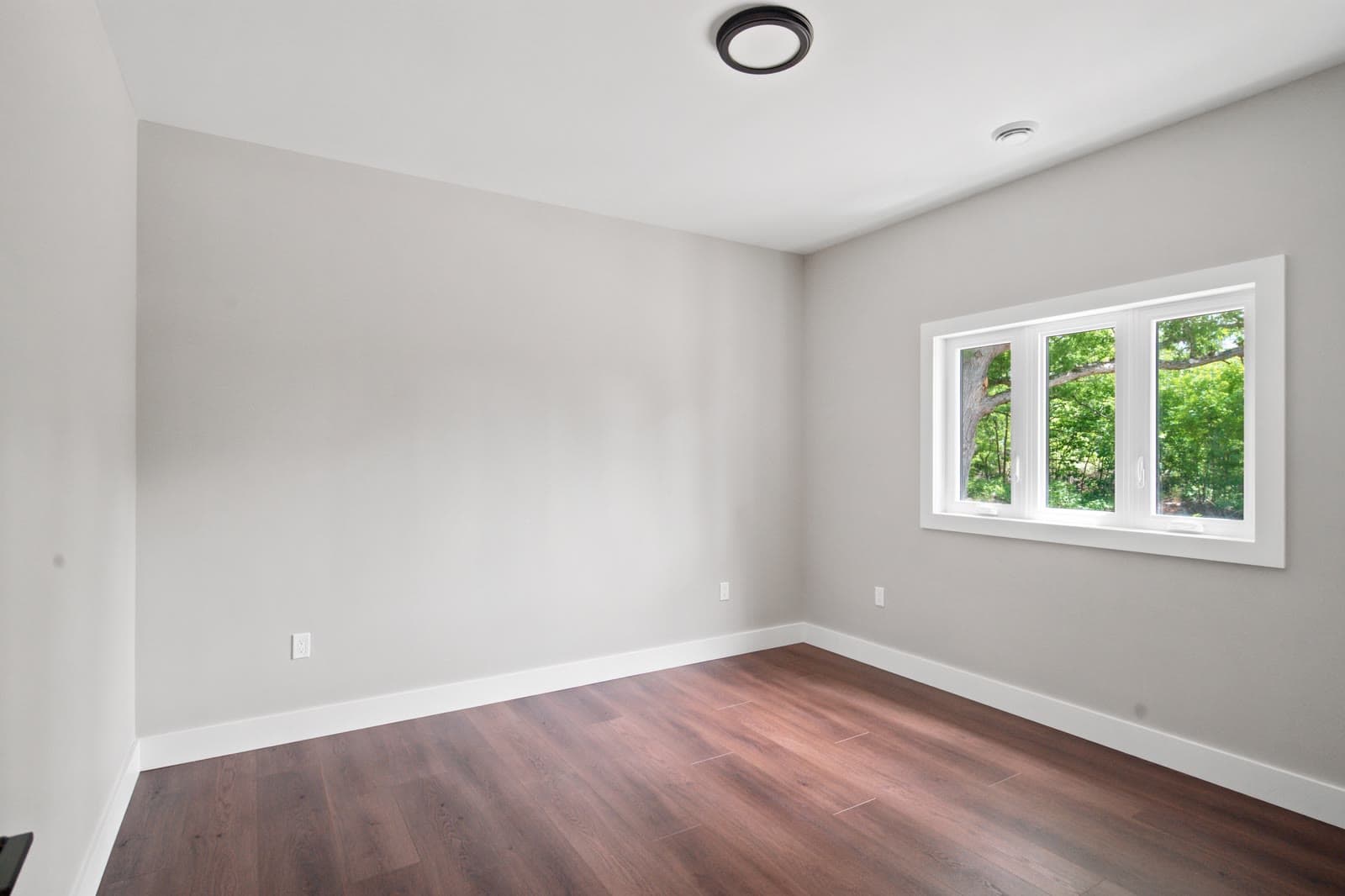 Empty, unstaged bedroom before digital staging
